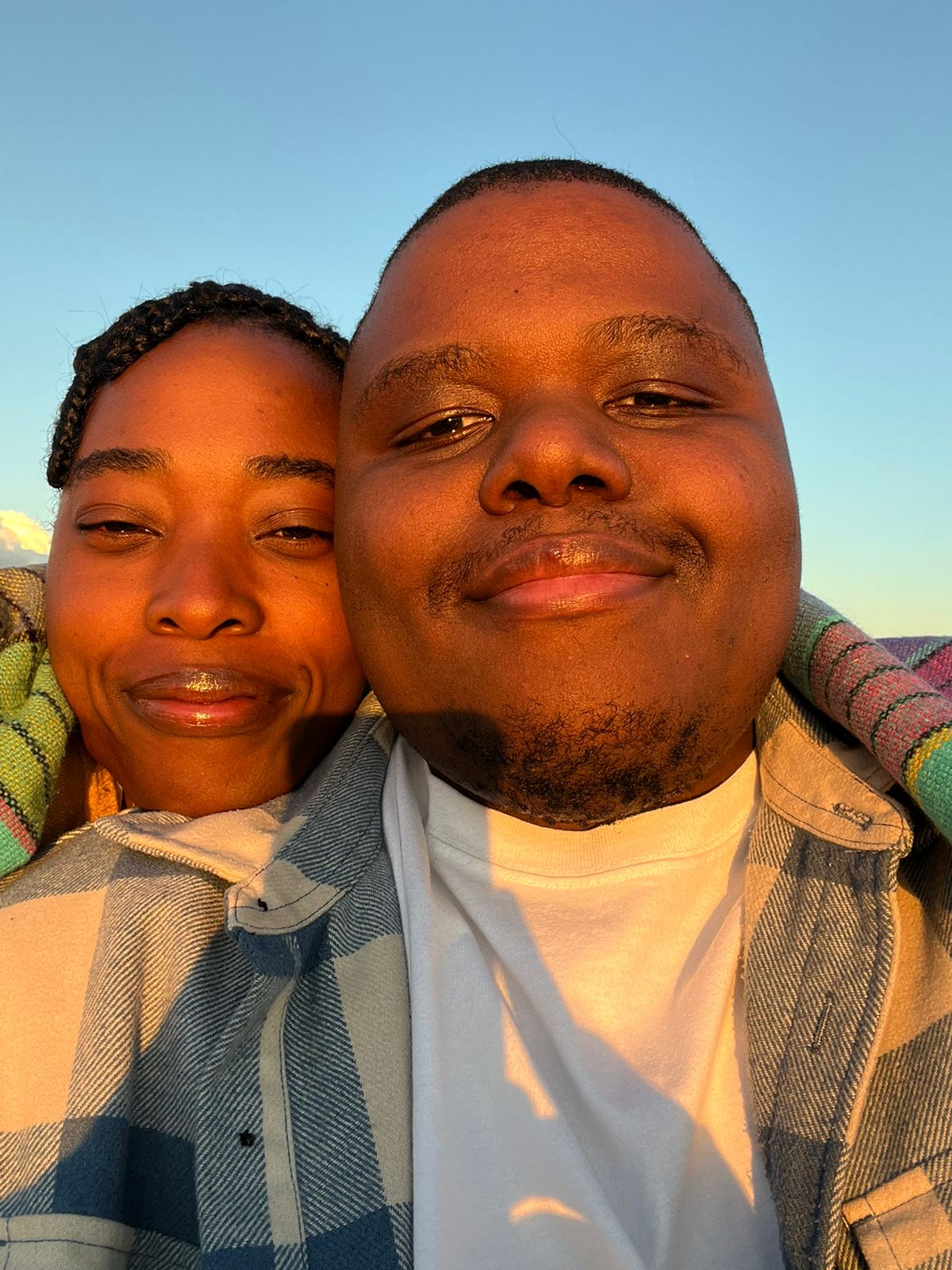 The two of us cheek to cheek in the last of the sunlight